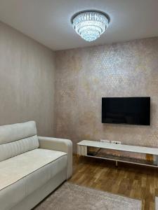 A television and/or entertainment centre at PANDORA AVENY CACAK