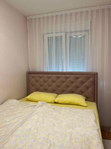 A bed or beds in a room at PANDORA AVENY CACAK
