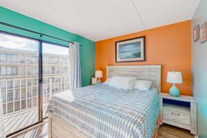 a bedroom with a bed and a large window at Wight Bay North #439 in Ocean City +17 photos