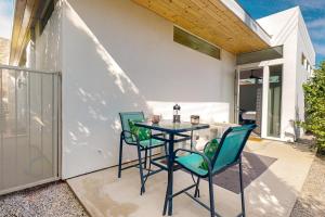 a patio with a table and chairs on a balcony at La Quinta Cove Retreat in La Quinta