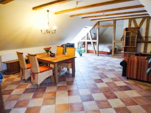 a dining room with a table and chairs at Ferienwohnung Mediterran in Malchow