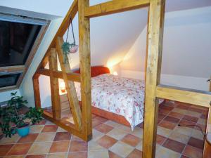 a bedroom with a wooden bunk bed in a room at Ferienwohnung Mediterran in Malchow