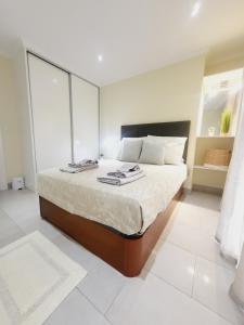 Giường trong phòng chung tại Casa Marcelino Refugio Frente Mar