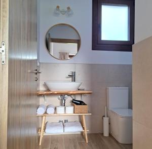 a bathroom with a sink and a toilet at Terradeva Apartamentos in Colombres +85 photos