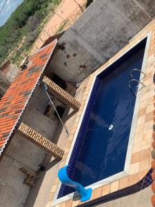 A piscina localizada em Casa de Praia Recanto da Brisa ou nos arredores
