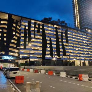 a large building with a large sign on the side of it at URBAN SUITES JSW STUDIO 3 ROOMS COMMERCIAL CONDO in Jelutong