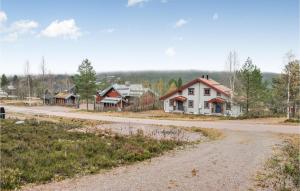an empty road in a village with houses at Lovely Apartment In Slen With House A Panoramic View in Sälen