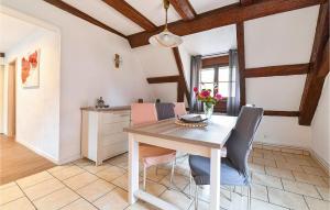 a dining room with a table and chairs at Amazing Apartment In Rouffach With 2 Bedrooms And Wifi in Rouffach