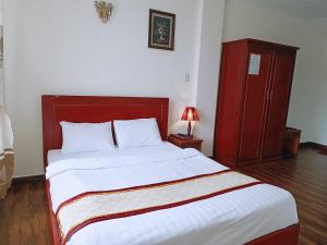 Postel nebo postele na pokoji v ubytování ANH ĐÀO HOTEL