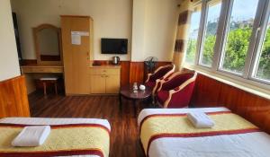 Postel nebo postele na pokoji v ubytování ANH ĐÀO HOTEL
