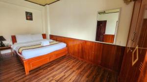 Postel nebo postele na pokoji v ubytování ANH ĐÀO HOTEL