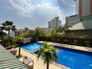 a swimming pool on the roof of a building at Galeri Ciumbuleuit Apartment 1 2BR 1BA - code 9A in Bandung