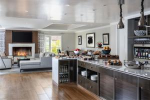 a kitchen and living room with a couch and a fireplace at The Ritz-Carlton, Laguna Niguel in Dana Point