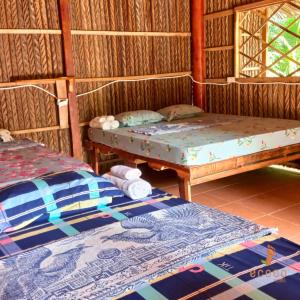 Postel nebo postele na pokoji v ubytování Ecoco Homestay Mekong