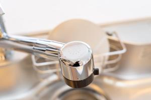 a close up of a hair dryer in a sink at Crystal Exe Nanki Shirahama 1 in Shirahama