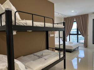 two bunk beds in a room with a balcony at HighPark Suites Kelana Jaya, Petaling Jaya by Sleepy Bear in Petaling Jaya +168 photos