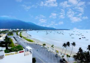 a view of a beach with boats in the water at Sontra Sea Hotel in Danang