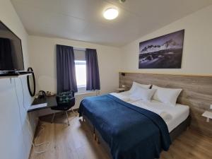 Postel nebo postele na pokoji v ubytování Guesthouse Mikael