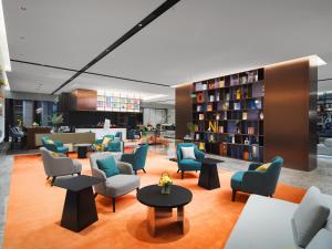 Area soggiorno di Hampton by Hilton Guangzhou Wenchong