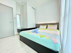 a bedroom with a bed with hearts on it at Straits Garden Suites Penang in Jelutong