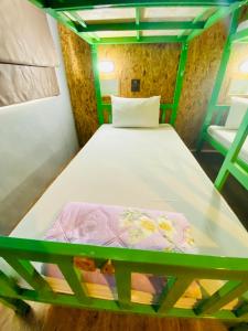 Postel nebo postele na pokoji v ubytování Frutta Hostel