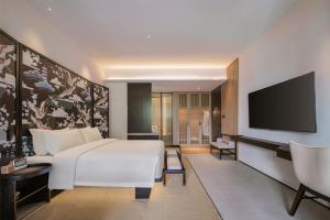 TV a/nebo společenská místnost v ubytování Tengchong Jingge Banshan Hot Spring Hotel