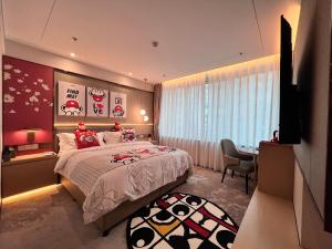 Ένα ή περισσότερα κρεβάτια σε δωμάτιο στο Howard Johnson Paragon Hotel Beijing Centra Provide tourism and ticketing service