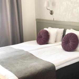 Postel nebo postele na pokoji v ubytování Viktoria Hotell & Konferens