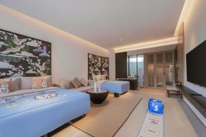 TV a/nebo společenská místnost v ubytování Tengchong Jingge Banshan Hot Spring Hotel