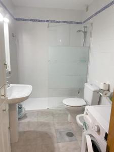 a bathroom with a toilet and a sink and a shower at Oleza Garden - Laguna Rosa - Playa Flamenca - Pool & Garden View. in Playa Flamenca