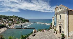 a view of a harbor with boats in the water at Panoramic Apartment in Villa on The Beach, In Center in Agropoli