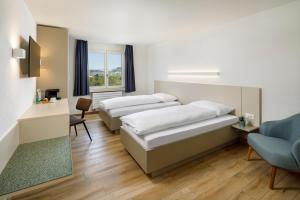Ένα ή περισσότερα κρεβάτια σε δωμάτιο στο Hotel an der Reuss