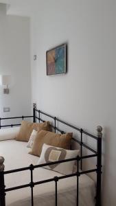 A bed or beds in a room at Affittacamere Arosio