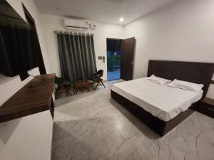 Ένα ή περισσότερα κρεβάτια σε δωμάτιο στο The Lagoon