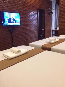 Postel nebo postele na pokoji v ubytování Ben Guesthouse