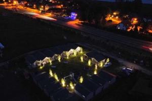 an aerial view of a yard at night with lights at New holiday homes for 2 people in Dziwn wek in Dziwnówek