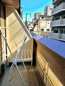 a metal object sitting on the side of a building at 水之道 in Osaka