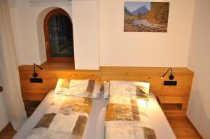 Postel nebo postele na pokoji v ubytování Haus Alpenglühn