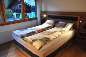 Postel nebo postele na pokoji v ubytování Haus Alpenglühn