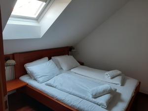 Postel nebo postele na pokoji v ubytování Penzion Planicka