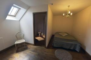 Cama o camas de una habitación en Les Gîtes du Domaine de la Traxène