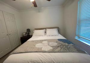 a bedroom with a bed with a flower pattern on it at Cozy One Bedroom Apartment At UWS in New York