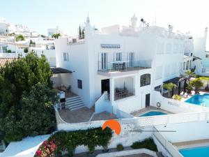 an aerial view of a white house with a swimming pool at #185 Private Marina and Ocean View with Pool in Albufeira