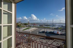 a view of a parking lot from a window at Dona Maria Hotel in Figueira da Foz