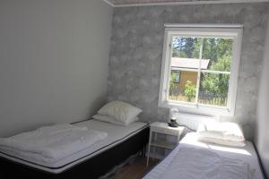 Postel nebo postele na pokoji v ubytování Tofta Beach