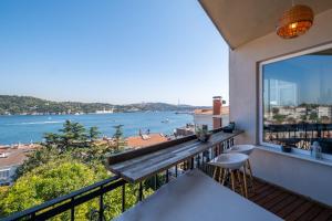 a balcony with a view of the water at Stunning 2Br Apt at the Brim of the Bosphorus in Istanbul