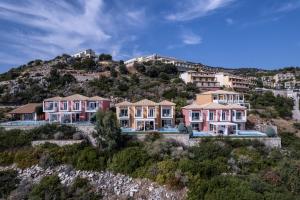 an aerial view of a house on a hill at Apostolata Island Resort and Spa in Skala