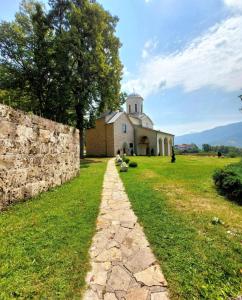a stone path in front of a building at Apartman Milanovic in Pribojska Banja +3 photos