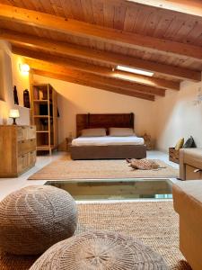 a bedroom with a bed and a wooden ceiling at Massaria Bove in Cervino