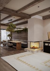 a living room with a fireplace and a dining table at Burchmulla Resorts in Burchmulla